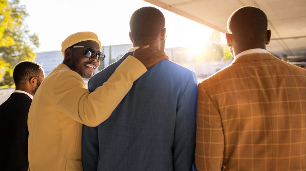 Rearview shot of a group of male friends in suits