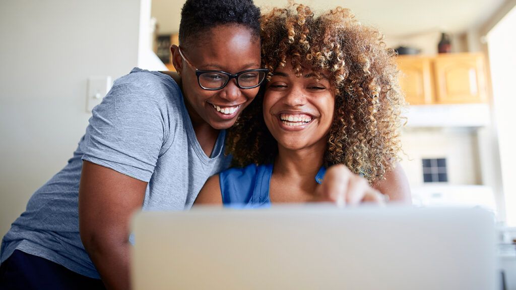 Couple looking at online therapy